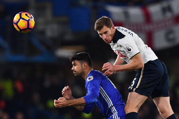 Tottenham Hotspur's Belgian defender Jan Vertonghen (R) climbs above Chelsea's Brazilian-born Spanish striker Diego Costa (L) to head the ball during the English Premier League football match between Chelsea and Tottenham Hotspur at Stamford Bridge in London on November 26, 2016. / AFP / Ben STANSALL / RESTRICTED TO EDITORIAL USE. No use with unauthorized audio, video, data, fixture lists, club/league logos or 'live' services. Online in-match use limited to 75 images, no video emulation. No use in betting, games or single club/league/player publications.  /         (Photo credit should read BEN STANSALL/AFP/Getty Images)
