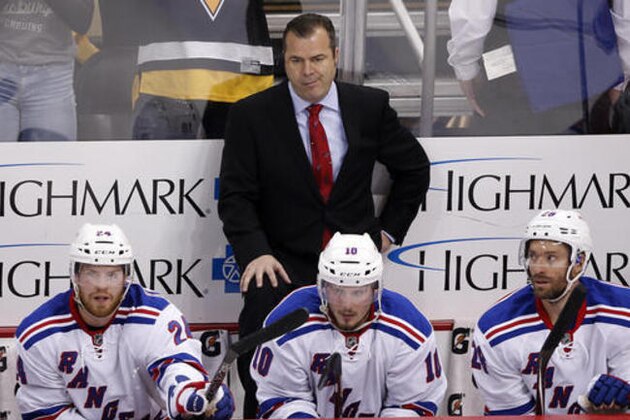 New York Rangers head coach Alain Vigneault stands behind his bench during the final minute of the third period in Game 5 of a first-round NHL playoff hockey game against the Pittsburgh Penguins in Pittsburgh, Saturday, April 23, 2016. The Penguins won 6-3, to clinch the best-of-seven games series 4-1. (AP Photo/Gene J. Puskar)