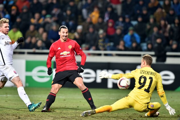 Manchester United's Swedish forward Zlatan Ibrahimovic (C) kicks to score a goal against Zorya Luhansk's Ukrainian goalkeeper Igor Levchenko during the UEFA Europa League football match between FC Zorya Luhansk and Manchester United FC at the Chornomorets stadium in Odessa on December 8, 2016. / AFP / SERGEI SUPINSKY        (Photo credit should read SERGEI SUPINSKY/AFP/Getty Images)