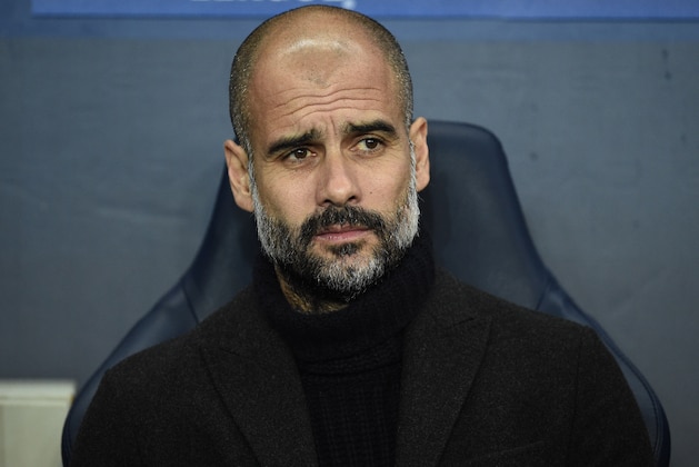 Manchester City's Spanish manager Pep Guardiola (R) and Celtic's Northern Irish manager Brendan Rodgers watch the players during the UEFA Champions League group C football match between Manchester City and Celtic at the Etihad Stadium in Manchester, northern England, on December 6, 2016. / AFP / Oli SCARFF        (Photo credit should read OLI SCARFF/AFP/Getty Images)