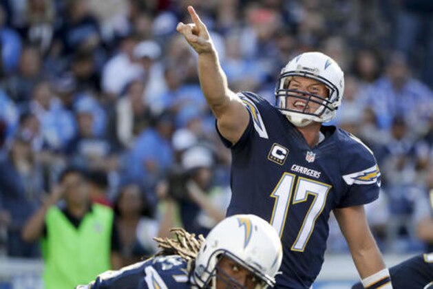 San Diego Chargers quarterback Philip Rivers yells to his team during the first half of an NFL football game against the Tampa Bay Buccaneers Sunday, Dec. 4, 2016, in San Diego. (AP Photo/Gregory Bull)