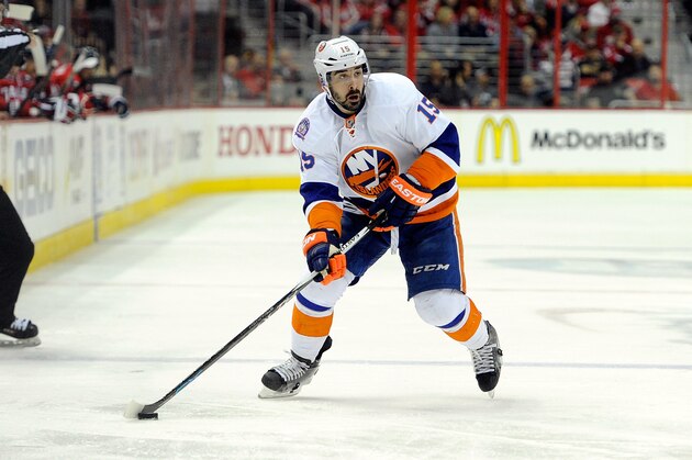 WASHINGTON, DC - APRIL 17:  Cal Clutterbuck #15 of the New York Islanders handles the puck against the Washington Capitals during Game Two of the Eastern Conference Quarterfinals during the 2015 NHL Stanley Cup Playoffs at Verizon Center on April 17, 2015 in Washington, DC.  (Photo by Greg Fiume/Getty Images)