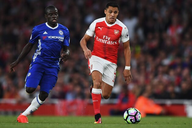 LONDON, ENGLAND - SEPTEMBER 24: Alexis Sanchez of Arsenal (R) takes the ball past N'Golo Kante of Chelsea (L)  during the Premier League match between Arsenal and Chelsea at the Emirates Stadium on September 24, 2016 in London, England.  (Photo by Shaun Botterill/Getty Images)