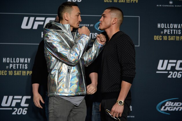TORONTO, CANADA - DECEMBER 08:  (L-R) Max Holloway and Anthony Pettis face off during the UFC 206 Ultimate Media Day event inside the Westin Harbour Castle Hotel on December 8, 2016 in Toronto, Ontario, Canada. (Photo by Brandon Magnus/Zuffa LLC/Zuffa LLC via Getty Images)