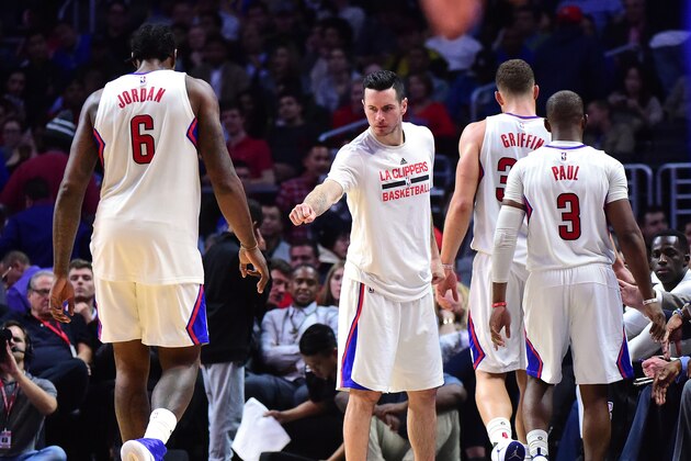 LOS ANGELES, CA - DECEMBER 07:  J.J. Redick #4 of the LA Clippers greets Blake Griffin #32, Chris Paul #3 and DeAndre Jordan #6 as they leave the game during a 115-98 Golden State Warriors win at Staples Center on December 7, 2016 in Los Angeles, California.  NOTE TO USER: User expressly acknowledges and agrees that, by downloading and or using this photograph, User is consenting to the terms and conditions of the Getty Images License Agreement.  (Photo by Harry How/Getty Images)