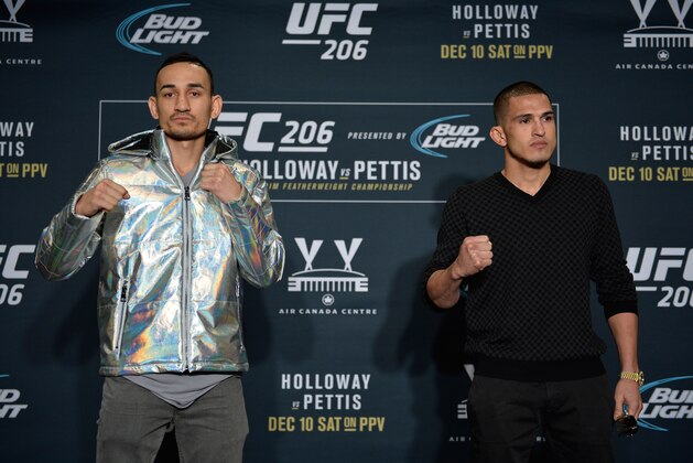 TORONTO, CANADA - DECEMBER 08:  (L-R) Max Holloway and Anthony Pettis pose for a picture during the UFC 206 Ultimate Media Day event inside the Westin Harbour Castle Hotel on December 8, 2016 in Toronto, Ontario, Canada. (Photo by Brandon Magnus/Zuffa LLC/Zuffa LLC via Getty Images)