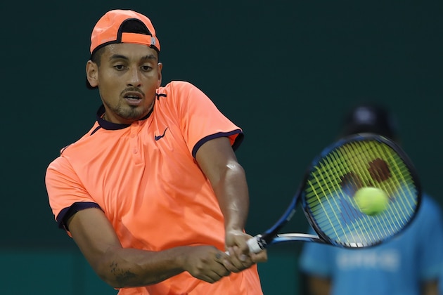 SHANGHAI, CHINA - OCTOBER 12:  Nick Kyrgios of Australia returns a shot against Mischa Zverev of Germany during the Men's singles second round match on day four of Shanghai Rolex Masters at Qi Zhong Tennis Centre on October 12, 2016 in Shanghai, China.  (Photo by Lintao Zhang/Getty Images)
