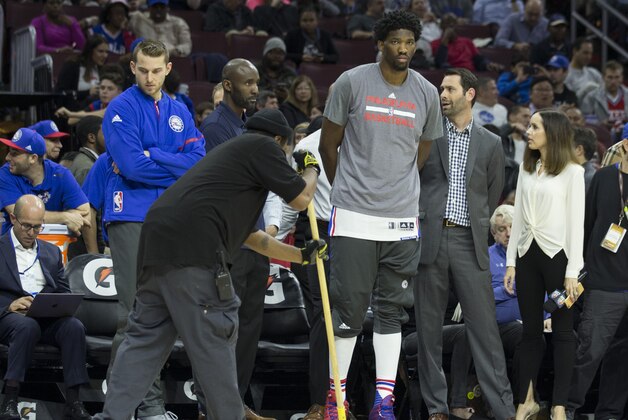 PHILADELPHIA, PA - NOVEMBER 30: Nik Stauskas #11 and Joel Embiid #21 of the Philadelphia 76ers look on a maintenance dries the court prior to the game against the Sacramento Kings at Wells Fargo Center on November 30, 2016 in Philadelphia, Pennsylvania. NOTE TO USER: User expressly acknowledges and agrees that, by downloading and or using this photograph, User is consenting to the terms and conditions of the Getty Images License Agreement. (Photo by Mitchell Leff/Getty Images)