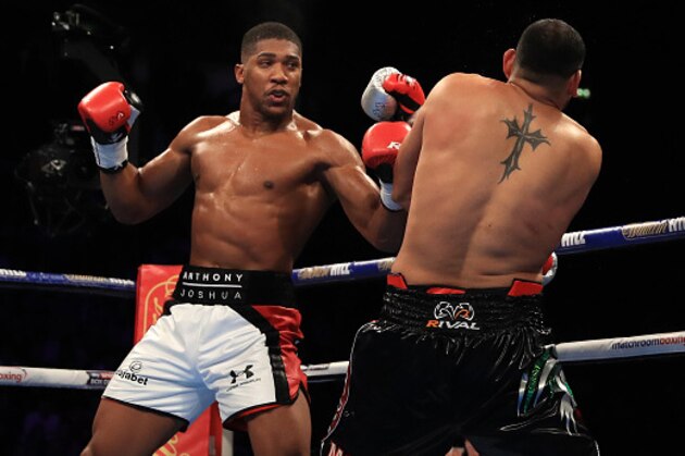 MANCHESTER, ENGLAND - DECEMBER 10:  Anthony Joshua (L) of London in action against Eric Molina of the United States during their IBF World Heavyweight Championship fight at Manchester Arena on December 10, 2016 in Manchester, England.  (Photo by Richard Heathcote/Getty Images)