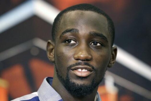 FILE- In this April 16, 2015, file photo, boxer Terence Crawford looks on during a news conference in Grapevine, Texas. The WBO super lightweight champion was found guilty Wednesday, Sept. 21, 2016, of two misdemeanors stemming from an April disturbance at a body shop in his hometown of Omaha, Nebraska. Police say Crawford causes $5,000 in damage to a hydraulic lift. Crawford will be sentenced in December for damage to property and disorderly conduct. (AP Photo/LM Otero, file)