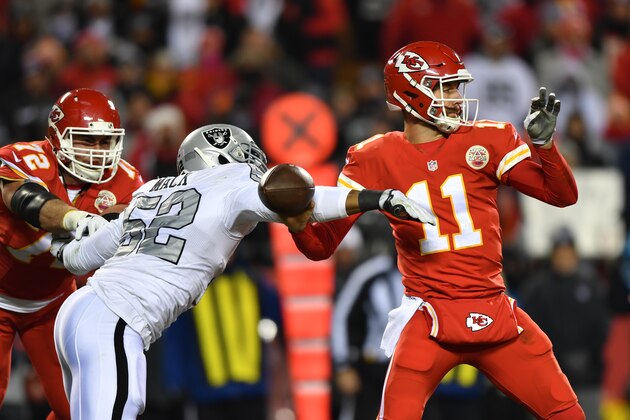 KANSAS CITY, MO - DECEMBER 8: Defensive end Khalil Mack #52 of the Oakland Raiders reaches out to strip the ball from quarterback Alex Smith #11 of the Kansas City Chiefs at Arrowhead Stadium during the third quarter of the game on December 8, 2016 in Kansas City, Missouri. (Photo by Peter Aiken/Getty Images)