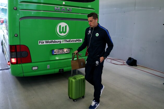 WOLFSBURG, GERMANY - SEPTEMBER 20: Julian Draxler of Wolfsburg arrives prior to the Bundesliga match between VfL Wolfsburg and Borussia Dortmund at Volkswagen Arena on September 20, 2016 in Wolfsburg, Germany. (Photo by Ronny Hartmann/Getty Images For MAN)