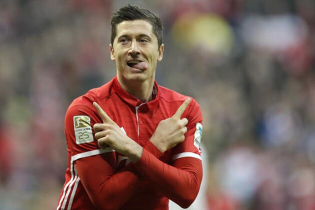 Bayern's Robert Lewandowski celebrates after scoring his side's second goal during the German Bundesliga soccer match between FC Bayern Munich and VfL Wolfsburg at the Allianz Arena stadium in Munich, Germany, Saturday, Dec. 10, 2016. (AP Photo/Matthias Schrader)