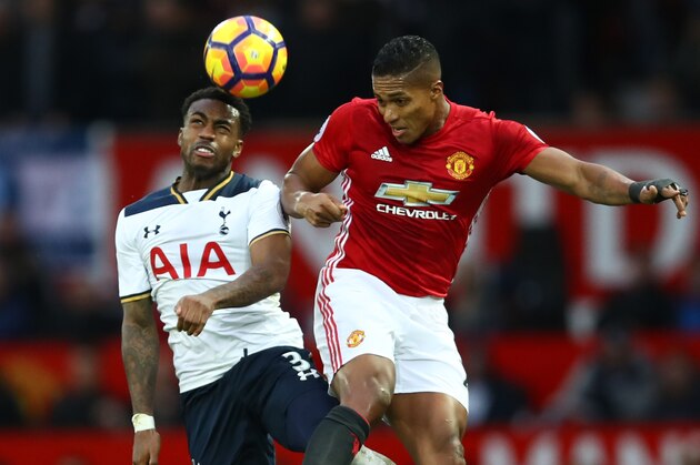 MANCHESTER, ENGLAND - DECEMBER 11:  Antonio Valencia of Manchester United and Danny Rose of Tottenham Hotspur compete for the ball during the Premier League match between Manchester United and Tottenham Hotspur at Old Trafford on December 11, 2016 in Manchester, England.  (Photo by Clive Brunskill/Getty Images)