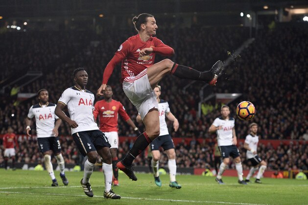 Manchester United's Swedish striker Zlatan Ibrahimovic crosses the ball during the English Premier League football match between Manchester United and Tottenham Hotspur at Old Trafford in Manchester, north west England, on December 11, 2016. / AFP / OLI SCARFF / RESTRICTED TO EDITORIAL USE. No use with unauthorized audio, video, data, fixture lists, club/league logos or 'live' services. Online in-match use limited to 75 images, no video emulation. No use in betting, games or single club/league/player publications.  /         (Photo credit should read OLI SCARFF/AFP/Getty Images)