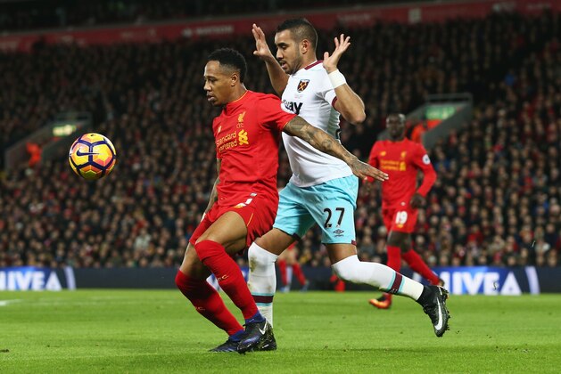 LIVERPOOL, ENGLAND - DECEMBER 11: Nathaniel Clyne of Liverpool controls the ball under pressure of Dimitri Payet of West Ham United during the Premier League match between Liverpool and West Ham United at Anfield on December 11, 2016 in Liverpool, England.  (Photo by Jan Kruger/Getty Images)