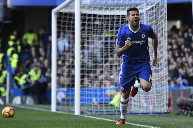 Chelsea's Brazilian-born Spanish striker Diego Costa celebrates after scoring the opening goal of the English Premier League football match between Chelsea and West Bromwich Albion at Stamford Bridge in London on December 11, 2016. / AFP / Justin TALLIS / RESTRICTED TO EDITORIAL USE. No use with unauthorized audio, video, data, fixture lists, club/league logos or 'live' services. Online in-match use limited to 75 images, no video emulation. No use in betting, games or single club/league/player publications.  /         (Photo credit should read JUSTIN TALLIS/AFP/Getty Images)