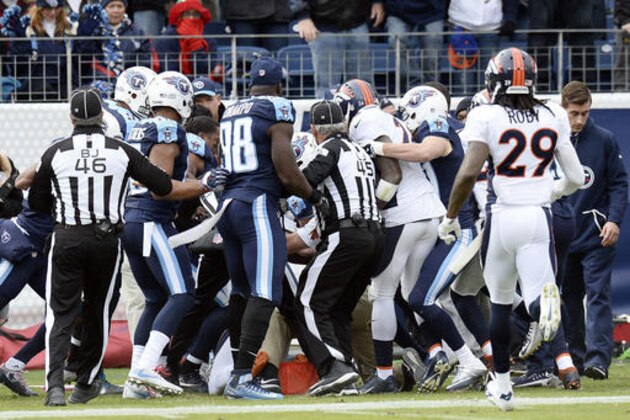 Tennessee Titans and Denver Broncos players push and shove during a scuffle in the first half of an NFL football game Sunday, Dec. 11, 2016, in Nashville, Tenn. (AP Photo/Mark Zaleski)