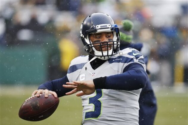 Seattle Seahawks quarterback Russell Wilson warms up before an NFL football game against the Green Bay Packers Sunday, Dec. 11, 2016, in Green Bay, Wis. (AP Photo/Mike Roemer)