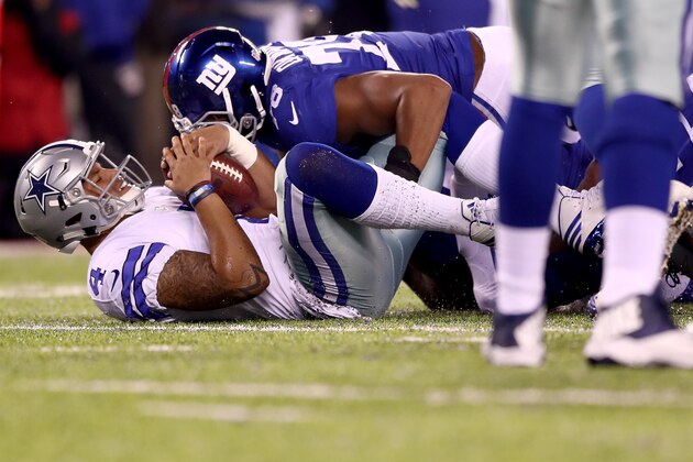 EAST RUTHERFORD, NJ - DECEMBER 11:  Dak Prescott #4 of the Dallas Cowboys gets sacked by Romeo Okwara #78 of the New York Giants during the second quarter of the game at MetLife Stadium on December 11, 2016 in East Rutherford, New Jersey.  (Photo by Elsa/Getty Images)