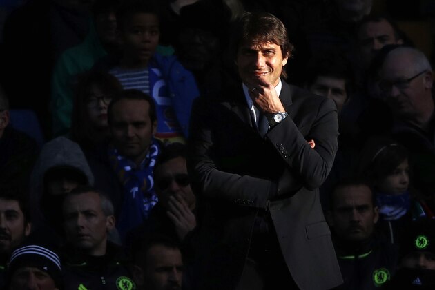 Chelsea's Italian head coach Antonio Conte watches from the touchline in the sunshine during the English Premier League football match between Chelsea and West Bromwich Albion at Stamford Bridge in London on December 11, 2016. / AFP / Adrian DENNIS / RESTRICTED TO EDITORIAL USE. No use with unauthorized audio, video, data, fixture lists, club/league logos or 'live' services. Online in-match use limited to 75 images, no video emulation. No use in betting, games or single club/league/player publications.  /         (Photo credit should read ADRIAN DENNIS/AFP/Getty Images)