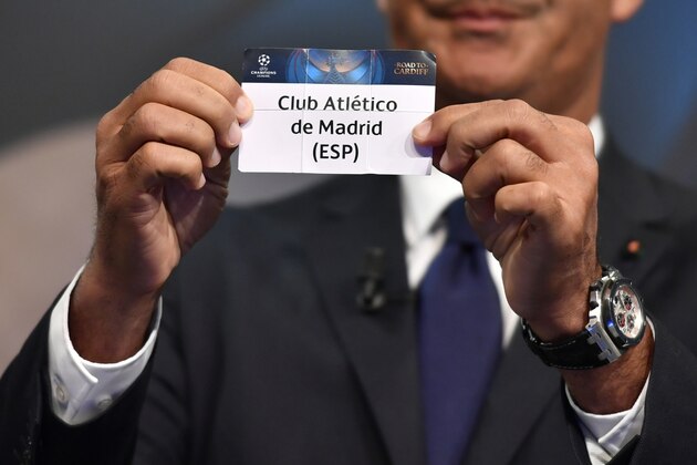 Netherlands' former striker Ruud Gullit shows the name of Atletico Madrid during the draw for the round of 16 of the UEFA Champions League football tournament at the UEFA headquarters in Nyon on December 12, 2016. / AFP / Fabrice COFFRINI        (Photo credit should read FABRICE COFFRINI/AFP/Getty Images)