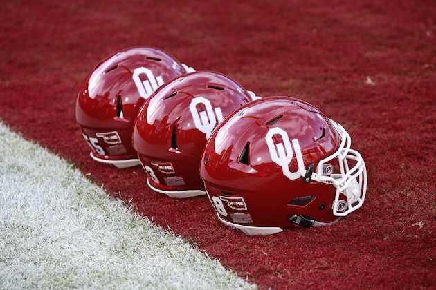 NORMAN, OK - OCTOBER 29:  Oklahoma Sooners helmets on the field before the game against the Kansas Jayhawks October 29, 2016 at Gaylord Family-Oklahoma Memorial Stadium in Norman, Oklahoma. The Sooners defeated the Jayhawks 56-3. (Photo by Brett Deering/Getty Images)