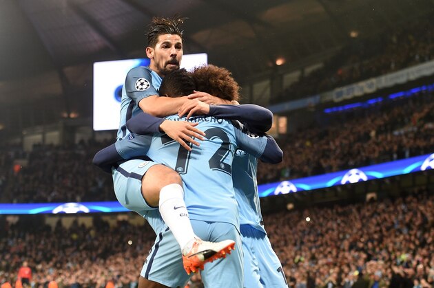 Manchester City's Nigerian striker Kelechi Iheanacho celebrates scoring his team's first goal with Manchester City's Spanish midfielder Nolito (L) and Manchester City's German midfielder Leroy Sane during the UEFA Champions League group C football match between Manchester City and Celtic at the Etihad Stadium in Manchester, northern England, on December 6, 2016. / AFP / Paul ELLIS        (Photo credit should read PAUL ELLIS/AFP/Getty Images)