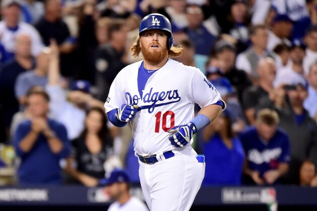 LOS ANGELES, CA - OCTOBER 18:  Justin Turner #10 of the Los Angeles Dodgers rounds the bases after he hits a solo home run in the sixth inning against the Chicago Cubs in game three of the National League Championship Series at Dodger Stadium on October 18, 2016 in Los Angeles, California.  (Photo by Harry How/Getty Images)