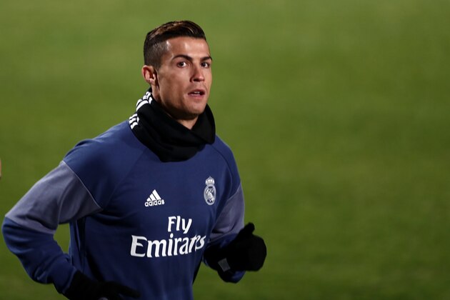 Real Madrid's Portuguese forward Christiano Ronaldo runs during a training session at Mitsuzawa stadium in Yokohama on December 12, 2016 ahead of their Club World Cup football match against Club America of Mexico on December 15. / AFP / Behrouz MEHRI        (Photo credit should read BEHROUZ MEHRI/AFP/Getty Images)