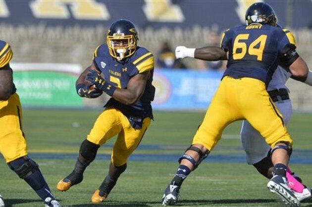 Toledo Rockets running back Terry Swanson (2) rushes against Kent State during an NCAA college football game Saturday, Oct. 10, 2015, in Toledo, Ohio. Toledo won 38-7. (AP Photo/David Richard)