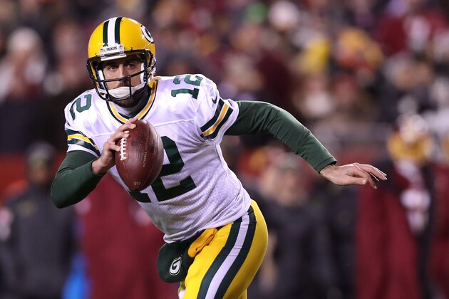 LANDOVER, MD - NOVEMBER 20: Quarterback Aaron Rodgers #12 of the Green Bay Packers scrambles with the ball against the Washington Redskins in the second quarter at FedExField on November 20, 2016 in Landover, Maryland. (Photo by Rob Carr/Getty Images)