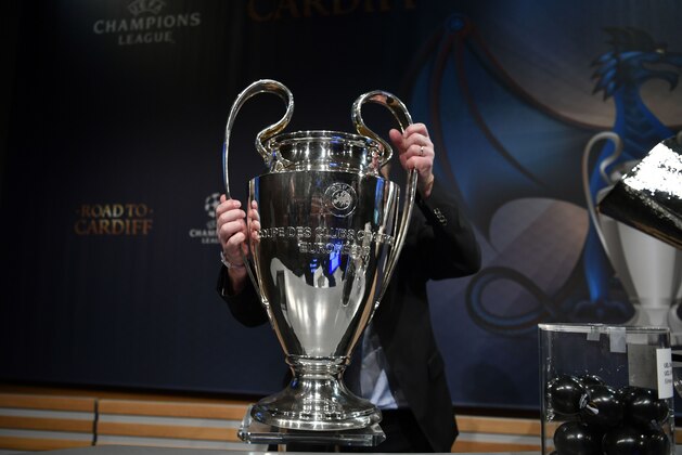 The UEFA Champions League trophy is taken away after the draw for the round of 16 of the UEFA Champions League football tournament at the UEFA headquarters in Nyon on December 12, 2016. / AFP / Fabrice COFFRINI (Photo credit should read FABRICE COFFRINI/AFP/Getty Images) The UEFA Champions League trophy is taken away after the draw for the round of 16 of the UEFA Champions League football tournament at the UEFA headquarters in Nyon on December 12, 2016. / AFP / Fabrice COFFRINI (Photo credit should read FABRICE COFFRINI/AFP/Getty Images)