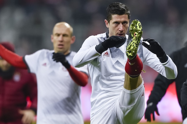 Bayern Munich's Polnish striker Robert Lewandowski warms up prior to the UEFA Champions League group D football match between FC Bayern Munich and Atletico Madrid in Munich, southern Germany, on December 6, 2016.  / AFP / GUENTER SCHIFFMANN        (Photo credit should read GUENTER SCHIFFMANN/AFP/Getty Images)