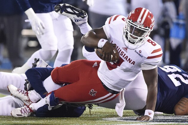 STATESBORO, GA - NOVEMBER 10: Quarterback Dion Ray #8 of the Louisiana Lafayette Ragin' Cajuns is brought down by Joshua Moon #22 of the Georgia Southern Eagles on November 10, 2016 at Paulson Stadium in Statesboro, Georgia.  (Photo by Todd Bennett/Getty Images)