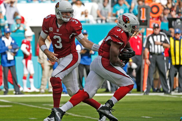 MIAMI GARDENS, FL - DECEMBER 11: Carson Palmer #3 hands the ball off to David Johnson #31 of the Arizona Cardinals during first quarter action against the Miami Dolphins on December 11, 2016 at Hard Rock Stadium in Miami Gardens, Florida. Miami defeated Arizona 26-23. (Photo by Joel Auerbach/Getty Images)