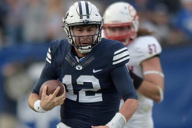 PROVO, UT - NOVEMBER 12: Quarterback Tanner Mangum #12 of the Brigham Young Cougars runs with the ball during their game against the Southern Utah Thunderbirds at LaVell Edwards Stadium on November 12, 2016 in Provo Utah. (Photo by Gene Sweeney Jr/Getty Images)