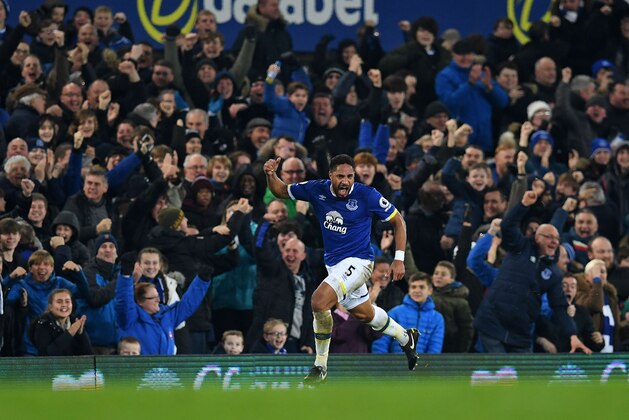 Everton's English-born Welsh defender Ashley Williams celebrates scoring his team's second goal during the English Premier League football match between Everton and Arsenal at Goodison Park in Liverpool, north west England on December 13, 2016. / AFP / Paul ELLIS / RESTRICTED TO EDITORIAL USE. No use with unauthorized audio, video, data, fixture lists, club/league logos or 'live' services. Online in-match use limited to 75 images, no video emulation. No use in betting, games or single club/league/player publications.  /         (Photo credit should read PAUL ELLIS/AFP/Getty Images)