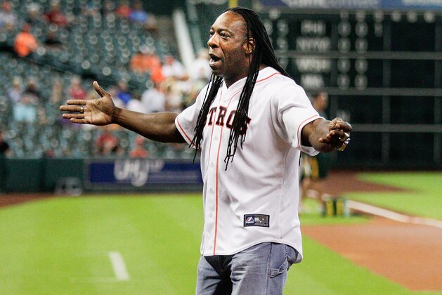HOUSTON, TX - JULY 29:  WWE Superstar Booker T throws out the first pitch at Minute Maid Park on July 29, 2014 in Houston, Texas.  (Photo by Bob Levey/Getty Images)