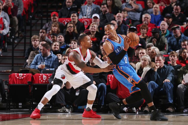 PORTLAND, OR - DECEMBER 13:  Russell Westbrook #0 of the Oklahoma City Thunder handles the ball against Damian Lillard #0 of the Portland Trail Blazers during the game on December 13, 2016 at the Moda Center in Portland, Oregon. NOTE TO USER: User expressly acknowledges and agrees that, by downloading and or using this Photograph, user is consenting to the terms and conditions of the Getty Images License Agreement. Mandatory Copyright Notice: Copyright 2016 NBAE (Photo by Sam Forencich/NBAE via Getty Images)