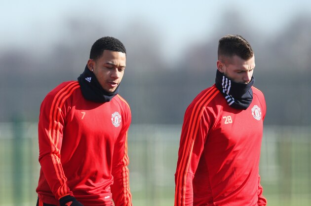 MANCHESTER, ENGLAND - FEBRUARY 24:  (L-R) Anthony Martial, Memphis Depay and Morgan Schneiderlin look on during a Manchester United training session ahead of their UEFA Europa League round of 32 second leg match against FC Midtjylland at the Aon Training Complex on February 24, 2016 in Manchester, United Kingdom.  (Photo by Jan Kruger/Getty Images)