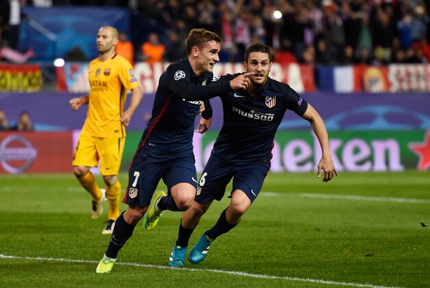MADRID, SPAIN - APRIL 13:  Antoine Griezmann of Atletico Madrid celebrates scoring his penalty with Koke for his team's second goal during the UEFA Champions League quarter final, second leg match between Club Atletico de Madrid and FC Barcelona at the Vincente Calderon on April 13, 2016 in Madrid, Spain.  (Photo by Mike Hewitt/Getty Images)