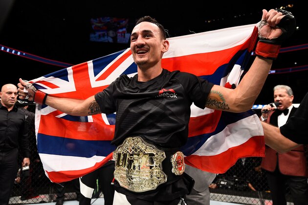 TORONTO, CANADA - DECEMBER 10:  Max Holloway celebrates his TKO victory over Anthony Pettis in their interim UFC featherweight championship bout during the UFC 206 event inside the Air Canada Centre on December 10, 2016 in Toronto, Ontario, Canada. (Photo by Jeff Bottari/Zuffa LLC/Zuffa LLC via Getty Images)