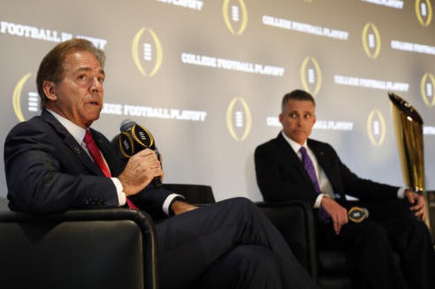 Alabama head coach Nick Saban speaks as Washington coach Chris Petersen looks on at right during a news conference Thursday, Dec. 8, 2016, in Atlanta. Alabama and Washington will face off in the Peach Bowl football game. (AP Photo/John Bazemore)