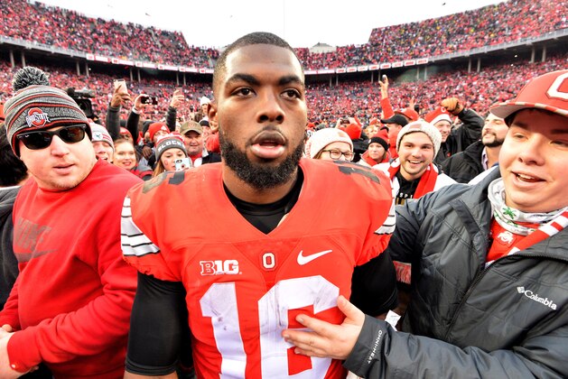 COLUMBUS, OH - NOVEMBER 26:   J.T. Barrett #16 of the Ohio State Buckeyes celebrates after defeating the Michigan Wolverines at Ohio Stadium on November 26, 2016 in Columbus, Ohio.  (Photo by Jamie Sabau/Getty Images)