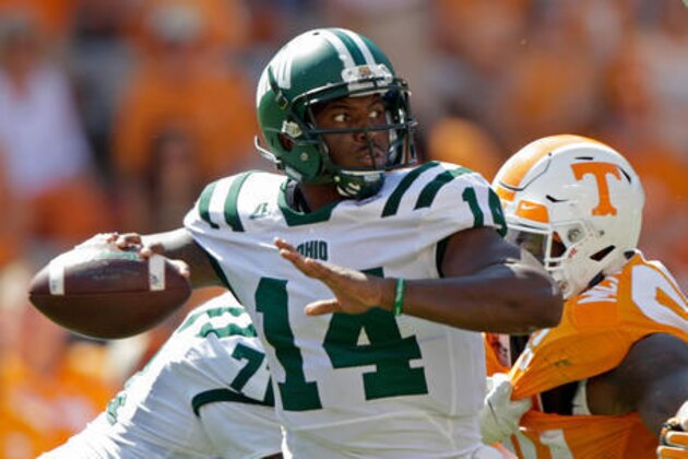 Ohio quarterback Greg Windham (14) throws to a receiver in the second half of an NCAA college football game as he's pressured by Tennessee defensive lineman Kahlil McKenzie (99) Saturday, Sept. 17, 2016, in Knoxville, Tenn. Tennessee won 28-19. (AP Photo/Wade Payne)