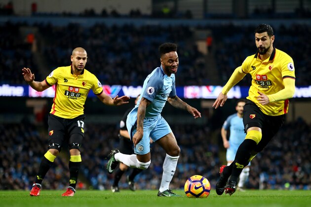 MANCHESTER, ENGLAND - DECEMBER 14: Raheem Sterling (C) of Manchester City controls the ball under pressure of Adlene Guedioura (L) and Miguel Britos (R) of Watford during the Premier League match between Manchester City and Watford at Etihad Stadium on December 14, 2016 in Manchester, England.  (Photo by Clive Brunskill/Getty Images)