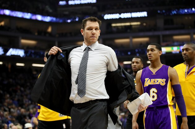 SACRAMENTO, CA - DECEMBER 12:  Head coach Luke Walton of the Los Angeles Lakers takes off his jacket after he was ejected from the game for a double technical fould after he complaned about a call during their game against the Sacramento Kings at Golden 1 Center on December 12, 2016 in Sacramento, California. NOTE TO USER: User expressly acknowledges and agrees that, by downloading and or using this photograph, User is consenting to the terms and conditions of the Getty Images License Agreement.  (Photo by Ezra Shaw/Getty Images)