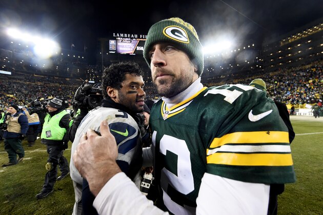 GREEN BAY, WI - DECEMBER 11:  Russell Wilson #3 of the Seattle Seahawks meets with Aaron Rodgers #12 of the Green Bay Packers after the Green Bay Packers beat the Seattle Seahawks 38-10 at Lambeau Field on December 11, 2016 in Green Bay, Wisconsin. (Photo by Stacy Revere/Getty Images)