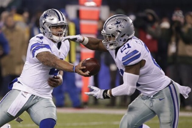 Dallas Cowboys quarterback Dak Prescott (4) hands the ball to Ezekiel Elliott (21) during the second half of an NFL football game against the New York Giants Sunday, Dec. 11, 2016, in East Rutherford, N.J. (AP Photo/Seth Wenig)